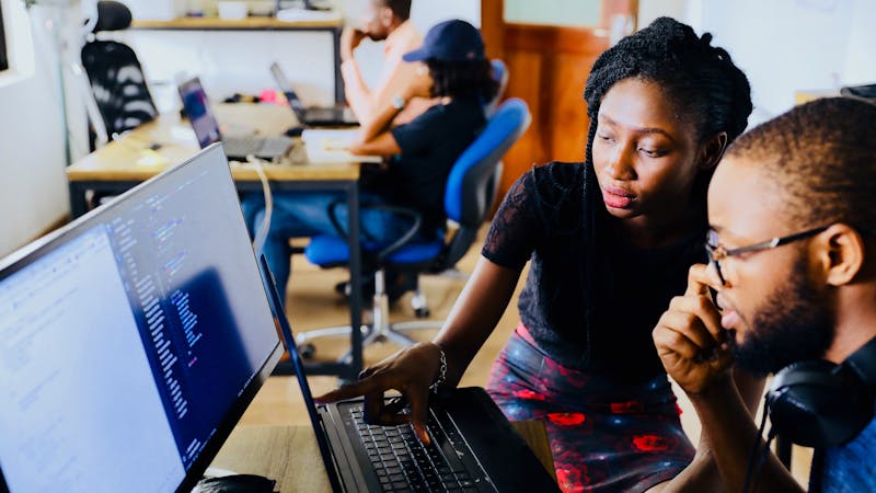 African students practising computer training.