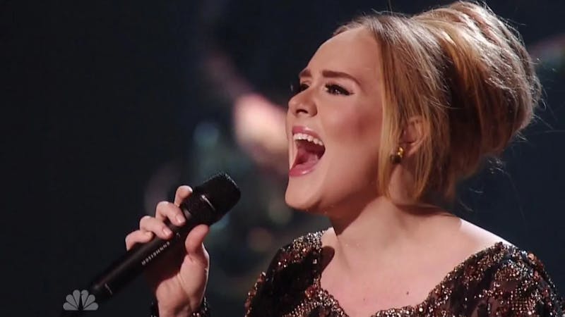 Famous English singer Adele on stage singing