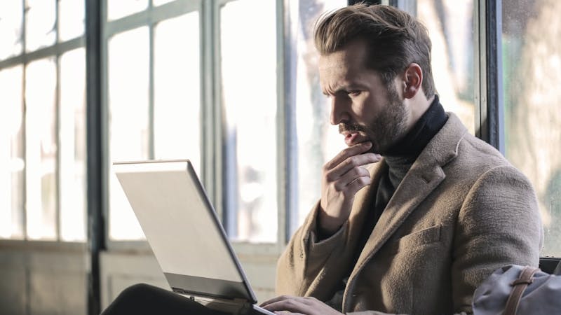 Business: A man going through his business records, mapping out plans for his company