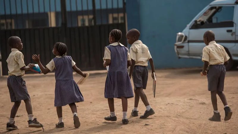 Primary school pupils on their way to school