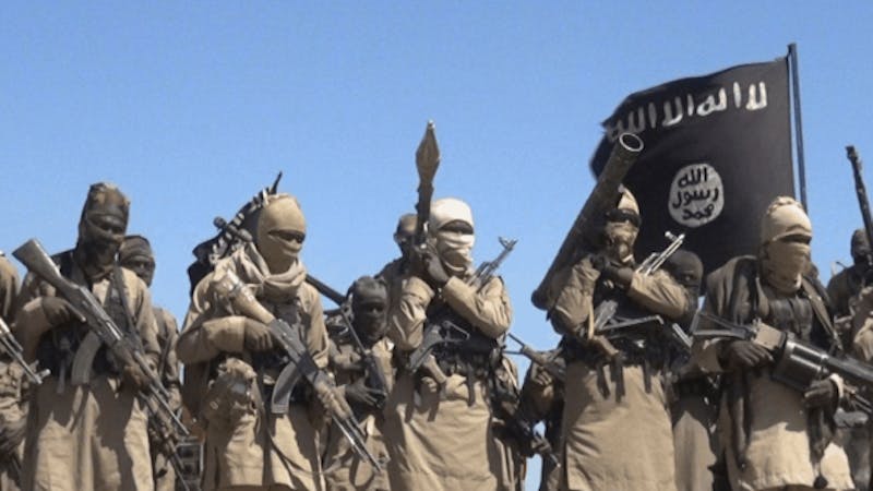 Terrorists carrying gun, with their faces covered