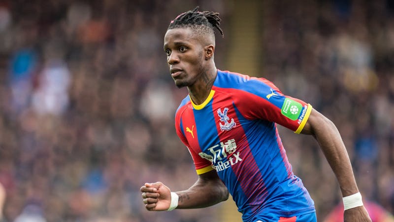 Crystal Palace Wilfred Zaha in action for his club wearing the home kit