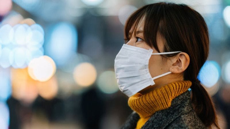 A lady wearing nose mask