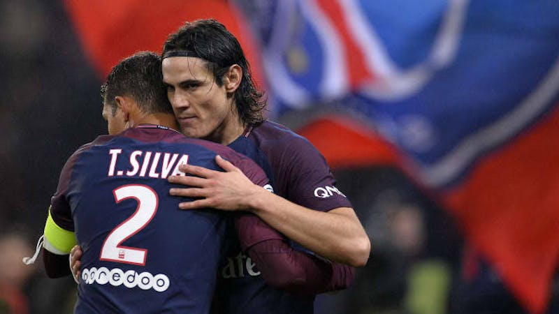 PSG pair Edison Cavani and Thiago Silva in a pitch celebrating after the final whistle