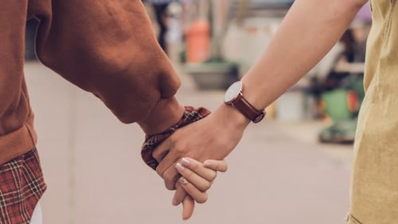 Friends holding hands