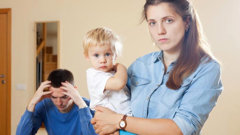 A beautiful woman with her child and husband