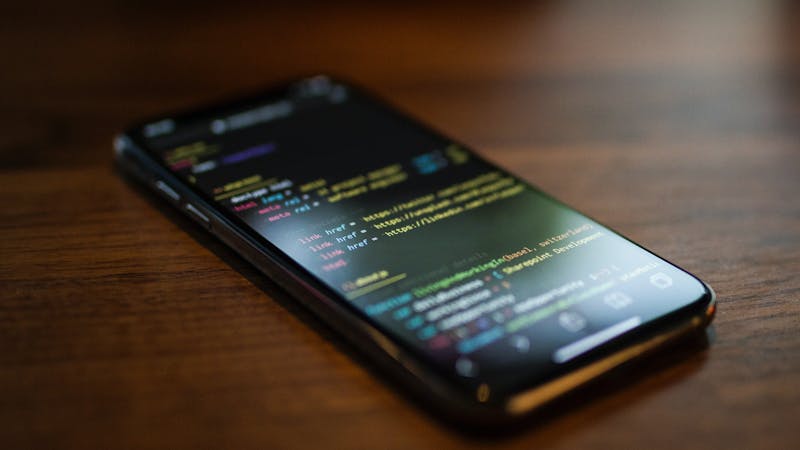 Image of mobile phone with HTML code snippet showing Link element