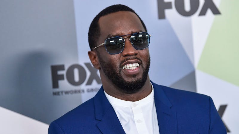 Famous American rapper Diddy in a blue suit