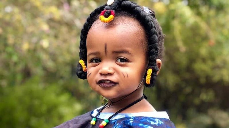 A baby in a Fulani attire made with Capalla