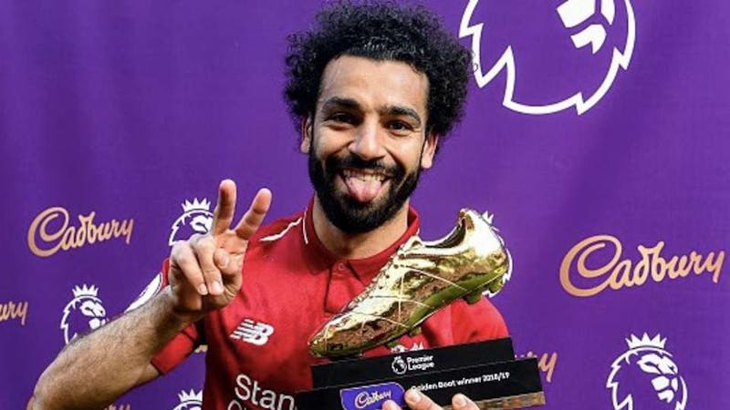 Mohammed Salah posing with the golden boot award for 2018/2019 Premier League Season