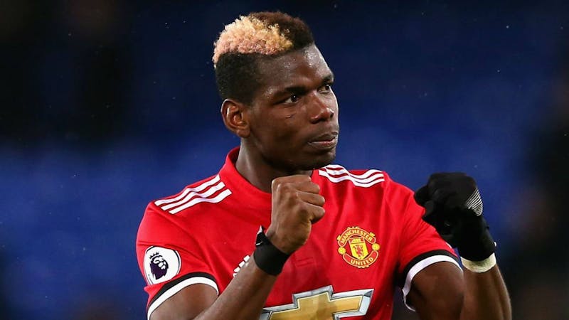 Paul Pogba in Manchester United home kit celebrating a goal