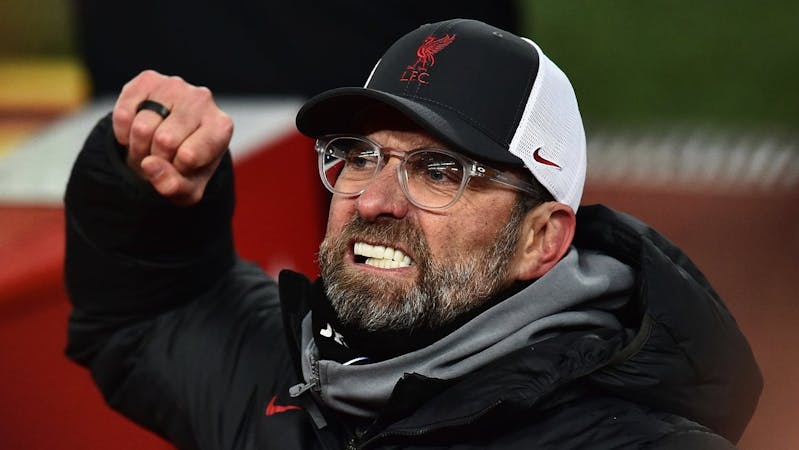 Jurgen Klopp of Liverpool fist bumps the air.