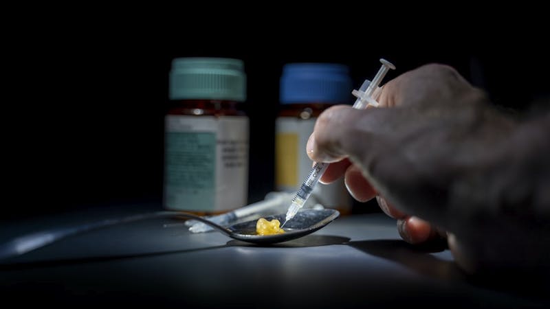 Drug addiction: A man taking tramadol, a narcotic-like pain killer