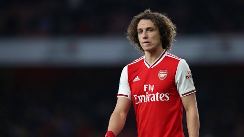 Arsenal defender David Luiz on Arsenal jersey frowning over a lost match