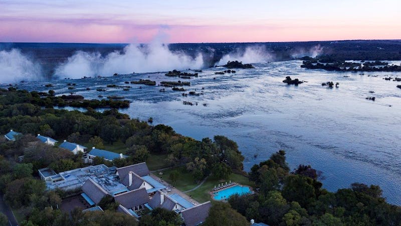 View of mist from River Zambezi Victoria Falls many kilometres away