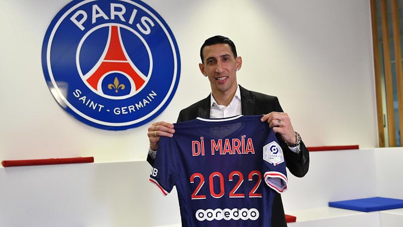 Ángel Di María poses with a PSG jersey after extending his contract till 2022.