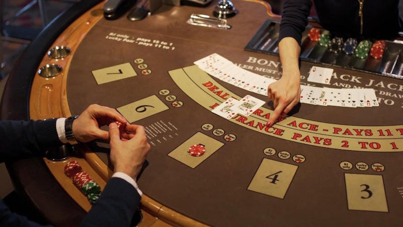 A casino with a poker game player.