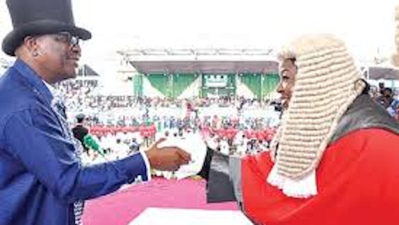 Gov. Wike of River State and Chief judge of the state during delivery of SUV vehicle to the Chief judges