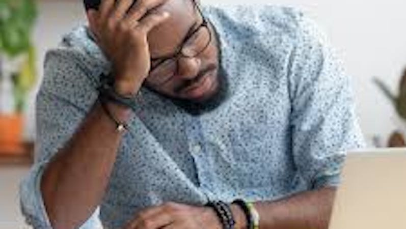 A young man very exhausted after answering video calls