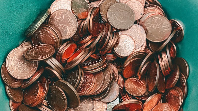 A bowel containing many coins.