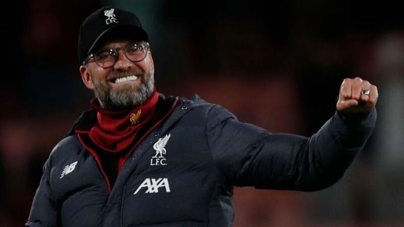 Liverpool manager Jurgen Klopp celebrating on the pitch