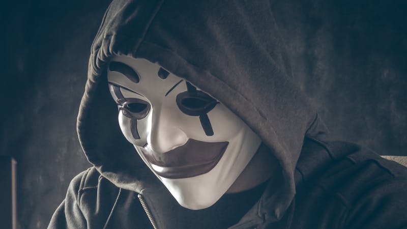 A software hacker trying to access a computer system.