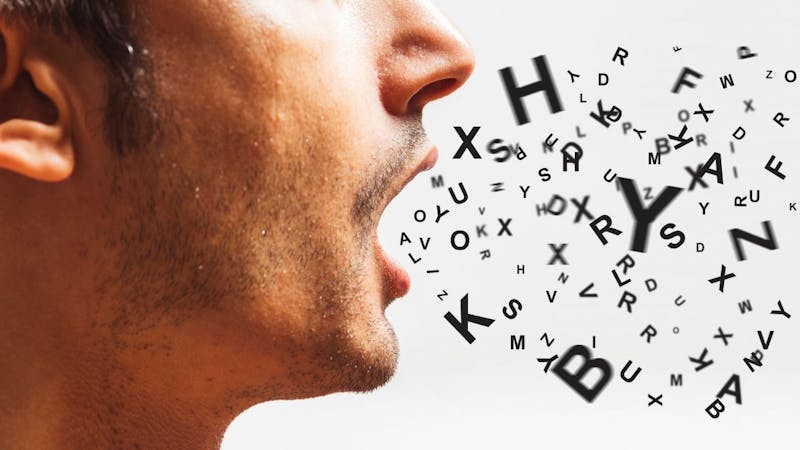 A man bringing lot of words fron his mouth