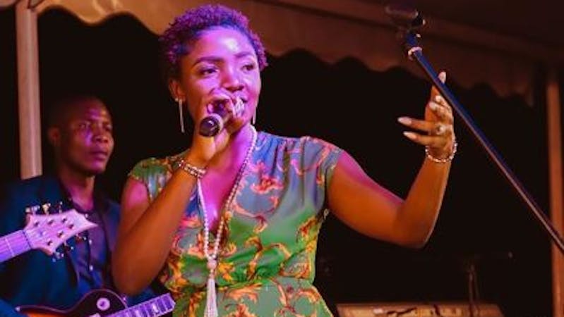 Simisola performing on a stage