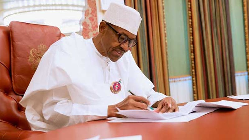 President Muhammadu Buhari signing documents