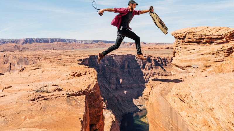 Fear makes you stronger: A scared man running and jumping a ditch