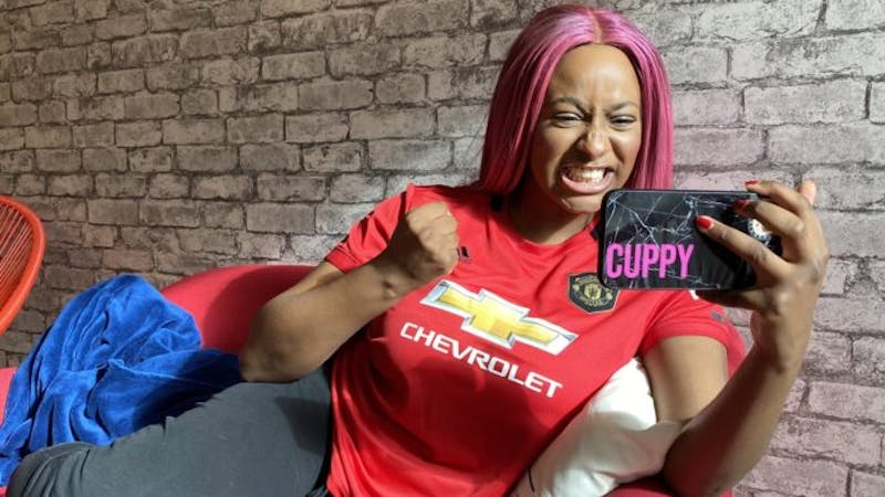 DJ Cuppy in her official Man U jersey