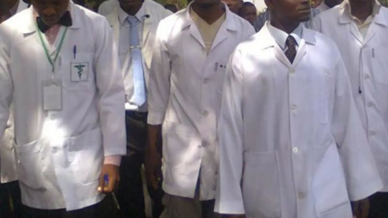 Health workers on their lab coat and medical equipments
