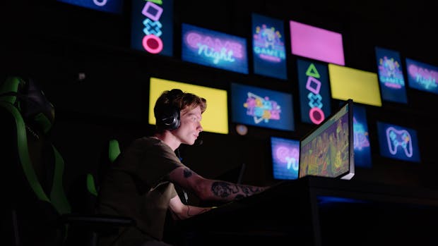 Image of boy playing game in a studio.