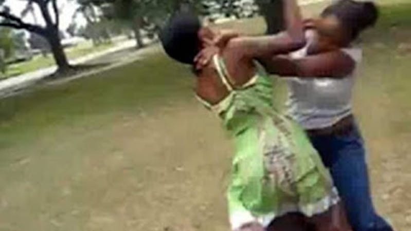 Two black women fighting over a man