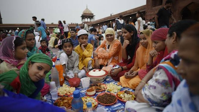 Holy Ramadan: A muslim family eating healthy meal during the Iftar