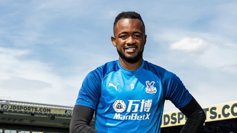 Crystal Palace striker Jordan Ayew poses with his player of the season's award.