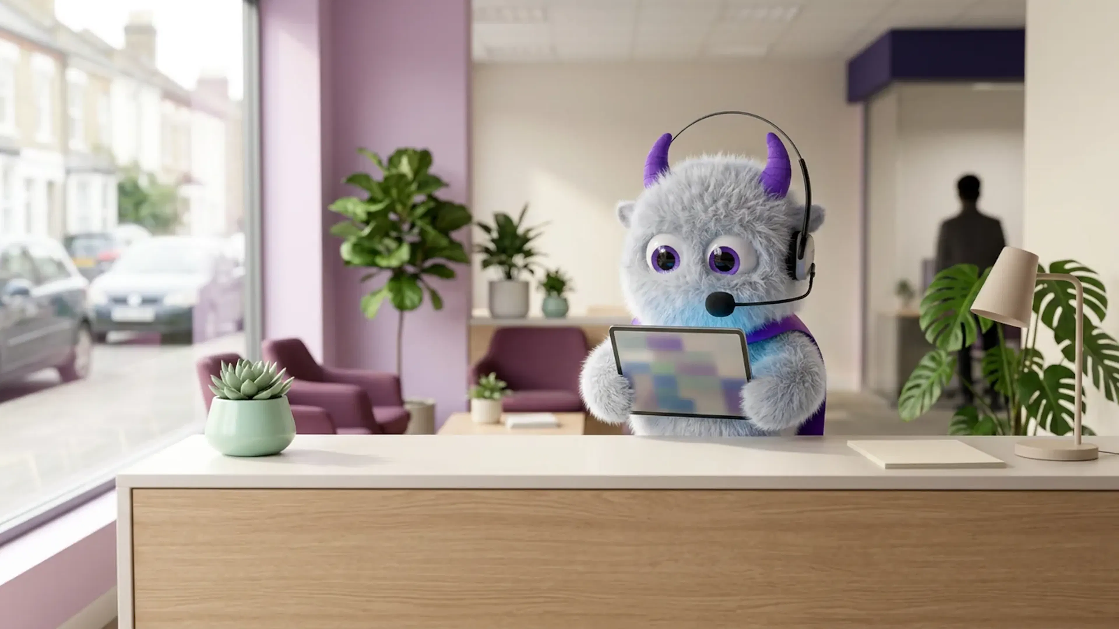 The Claimsline mascot reading a tablet at a bright office reception counter.