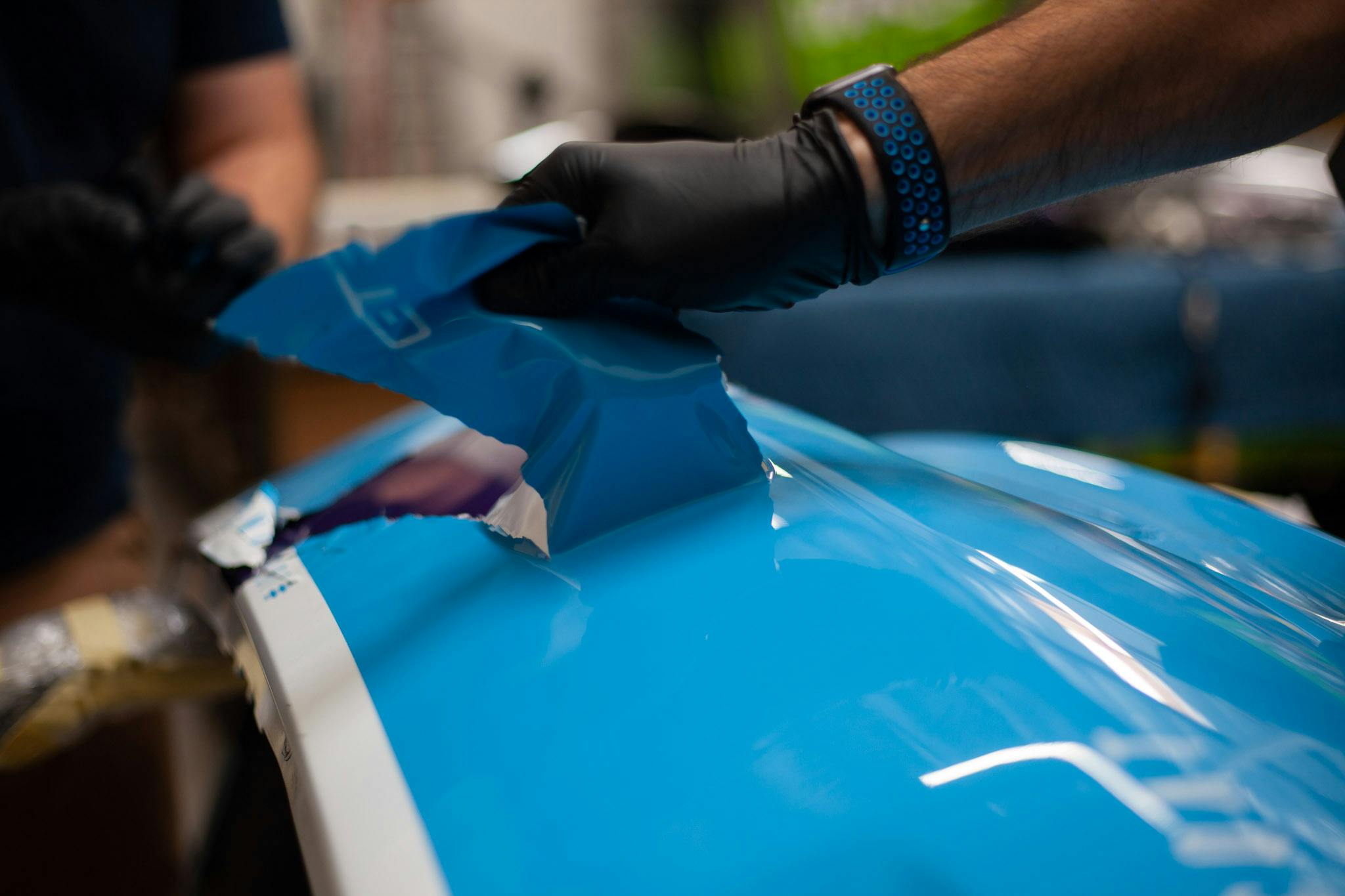 Peeling peelable paint easily on Porsche bumper
