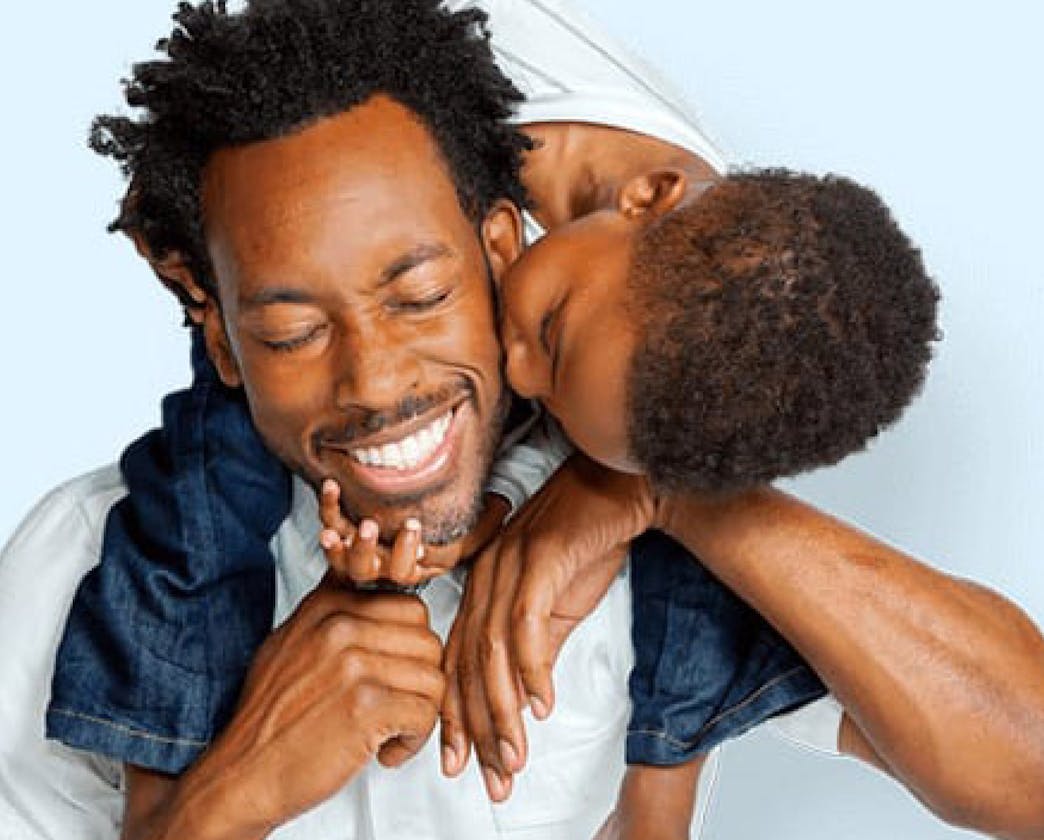 Son kissing father
