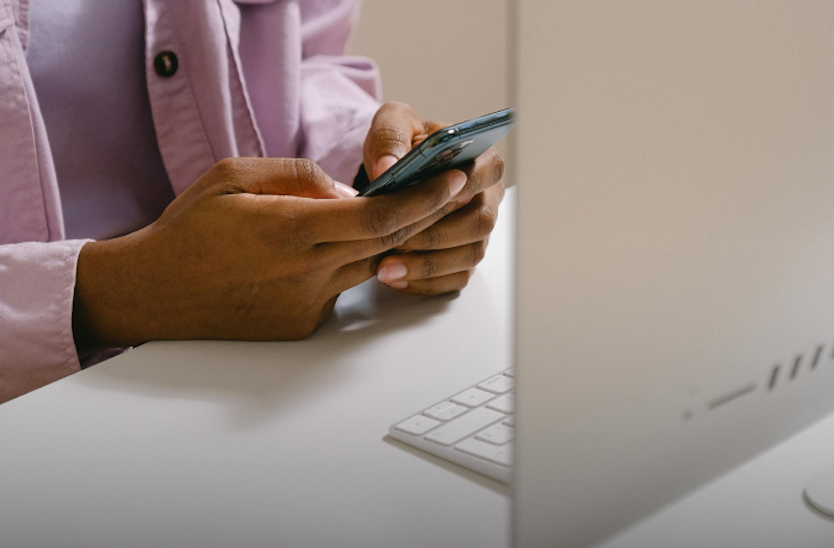 woman on cell phone and computer