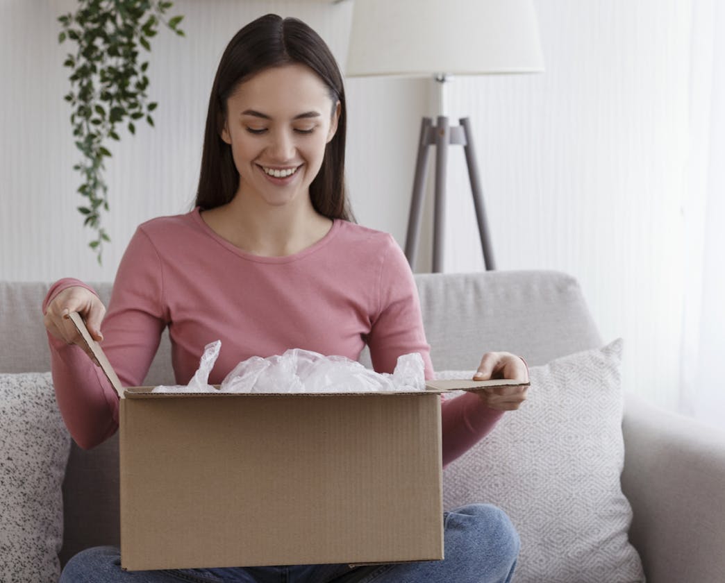 woman looking inside box