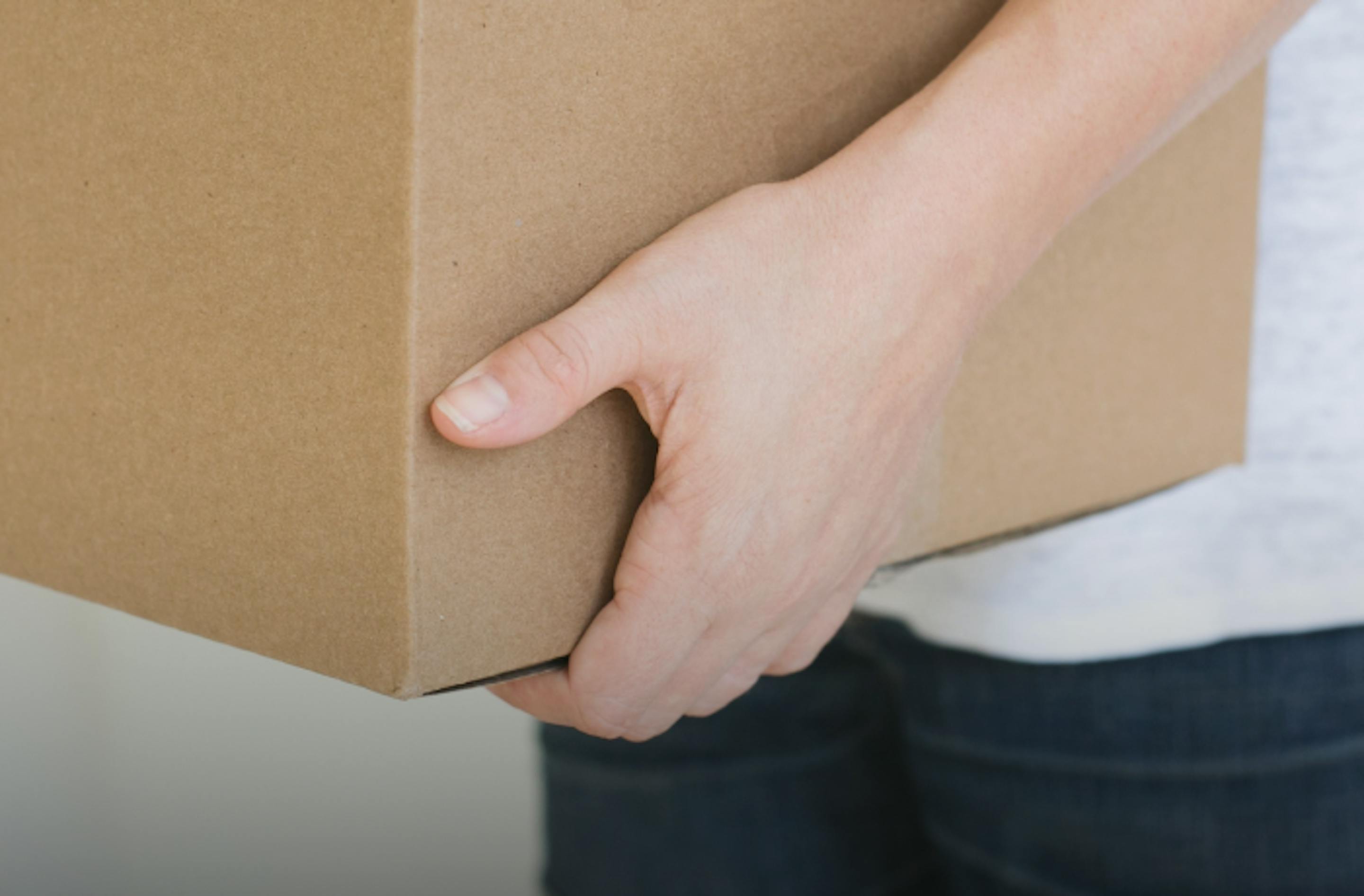 Person holding a box