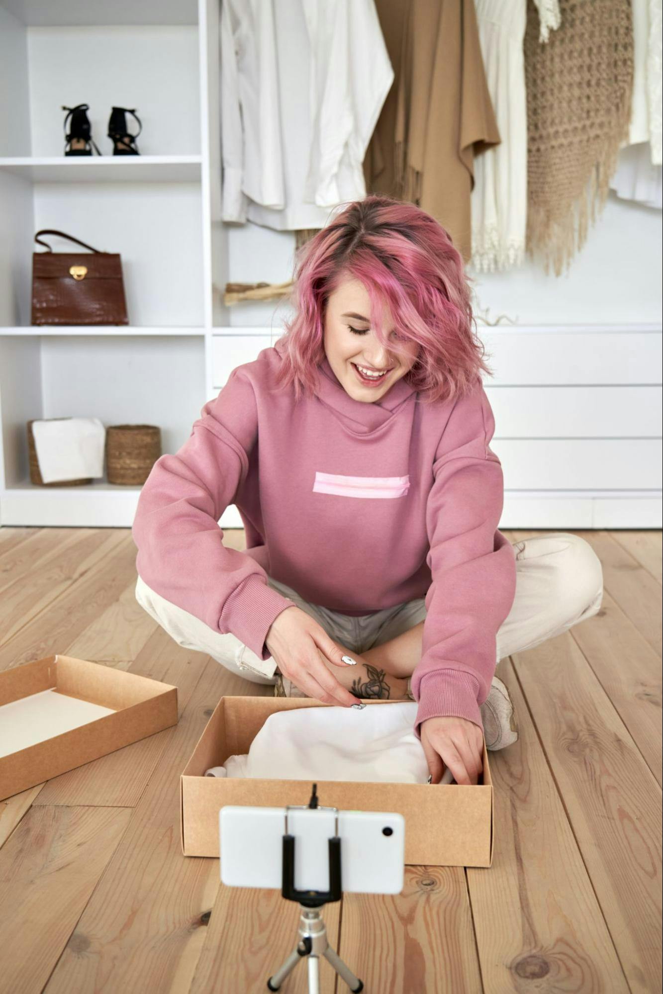 young woman unboxing package