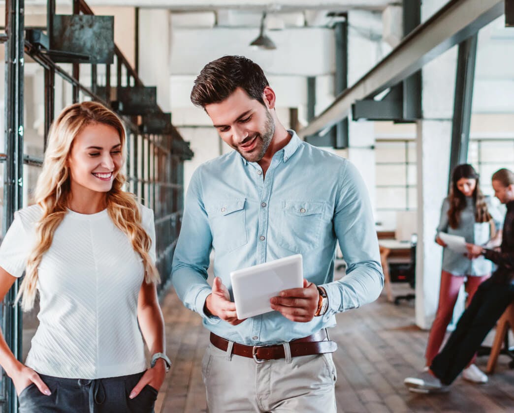 Two people walking discussing business
