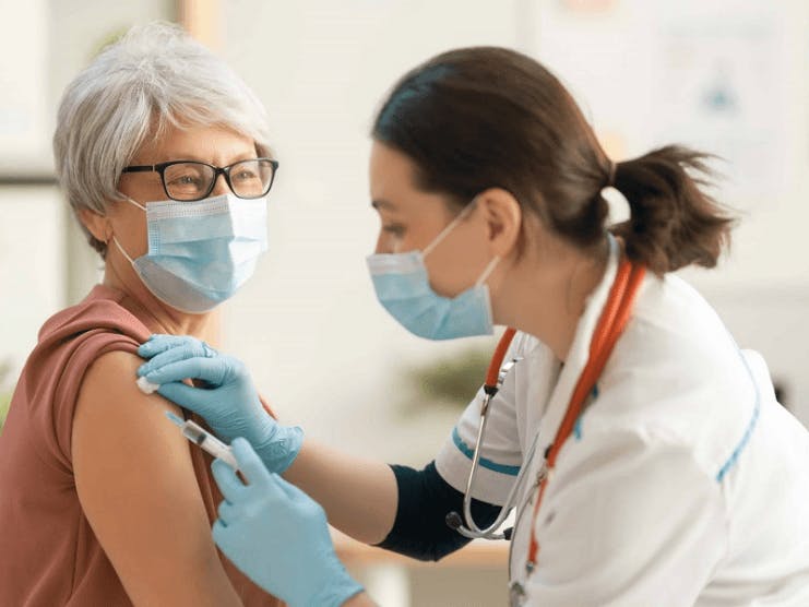 Doctor administering shot