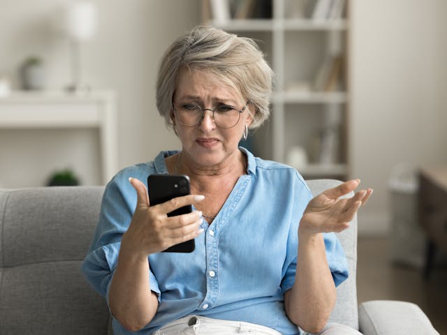 woman looking at her phone