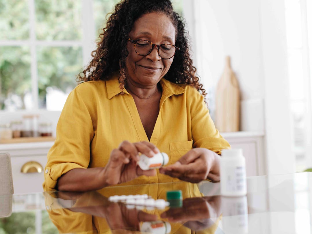 Senior woman taking prescription