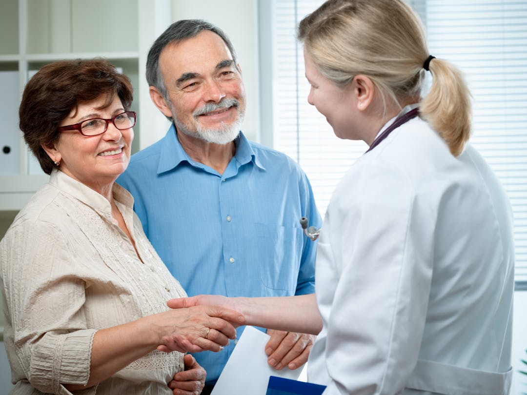 Older couple meeting with doctor