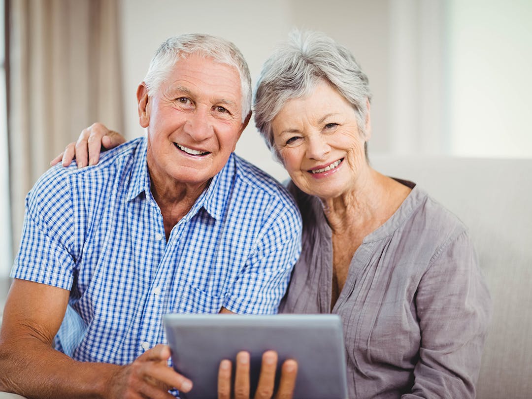 senior couple on tablet