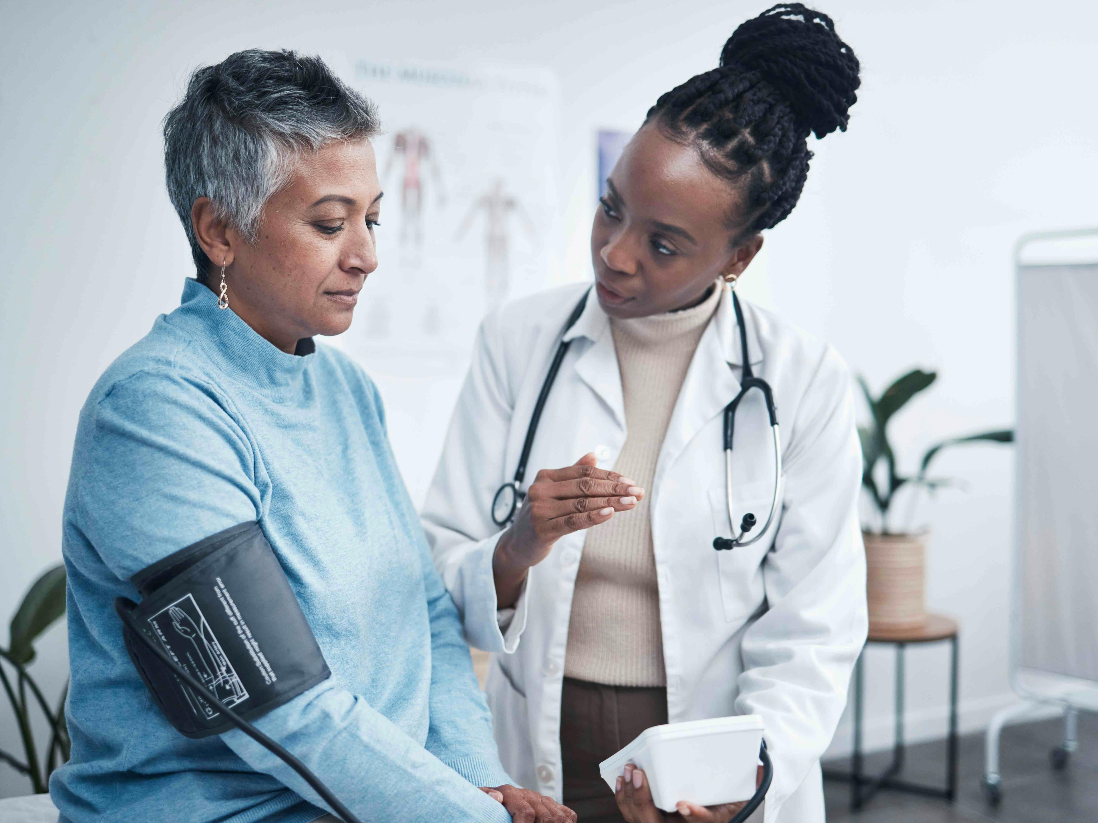 female doctor with senior female patient